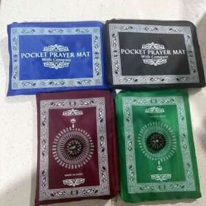 Pocket prayer mat with compass